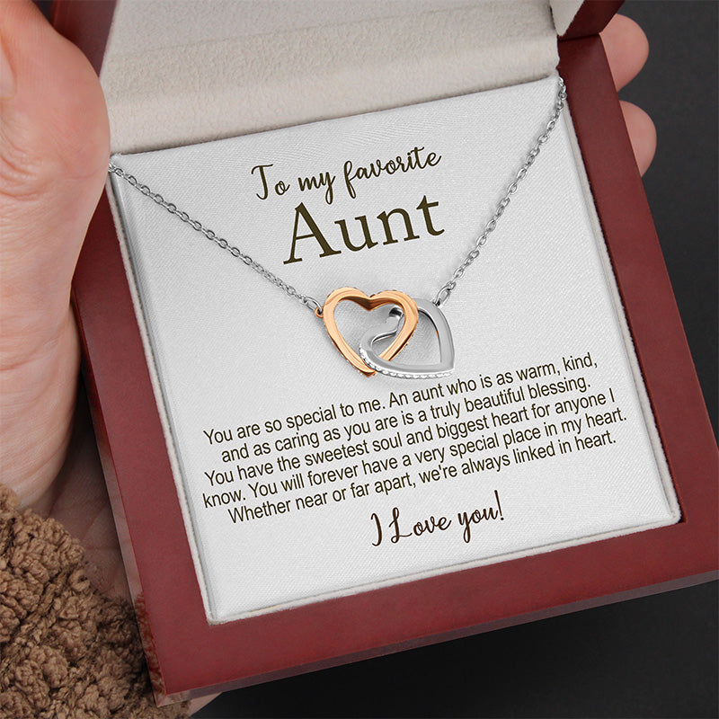 Necklace with heart pendant in a box addressed to 'my favorite Aunt' with a heartfelt message.