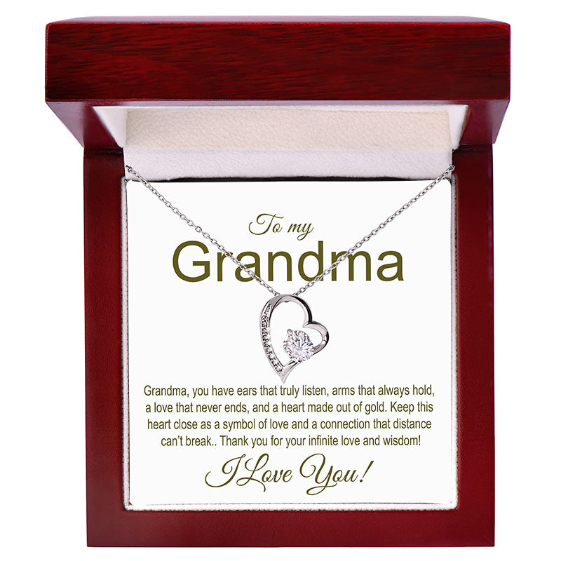 Heart-shaped necklace in a wooden box with a message for a grandma