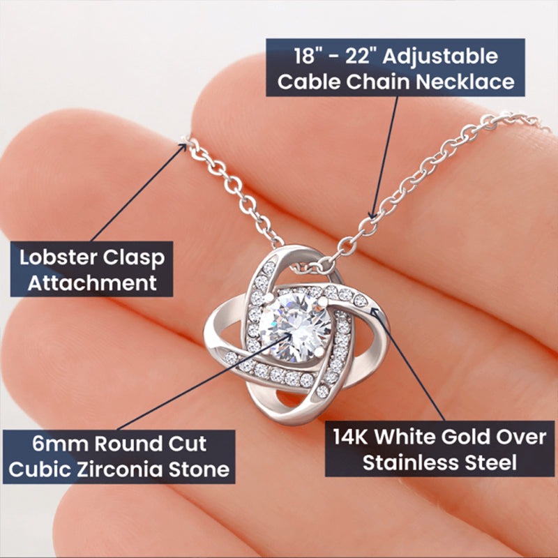 Love Knot Necklace Chart Information: 14K white gold finish over stainless steel, knot pendant 15.7 x 15.7 mm, centered 6 mm round cut Zirconia stone, 18"-22" adjustable chain, lobster clasp attachment.