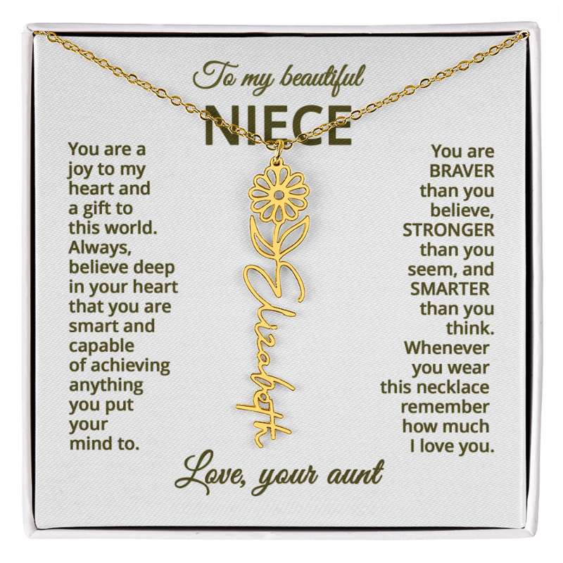 Gold necklace with a daisy flower pendant on a card with meaningful message for niece, displayed in a white box.