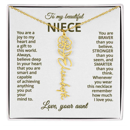 Gold necklace with poppy floral design on a card addressed to a niece, featuring sentimental message on a white background