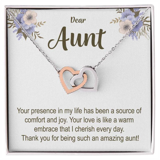 Necklace with interlocking heart pendants on a card for an aunt, featuring a heartfelt message.