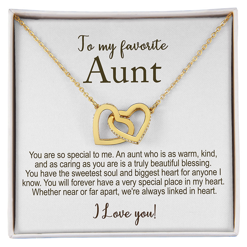 Gold necklace with interlocking hearts in a gift box with a message for an aunt.