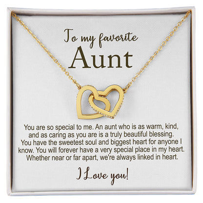Gold necklace with interlocking hearts in a gift box with a message for an aunt.