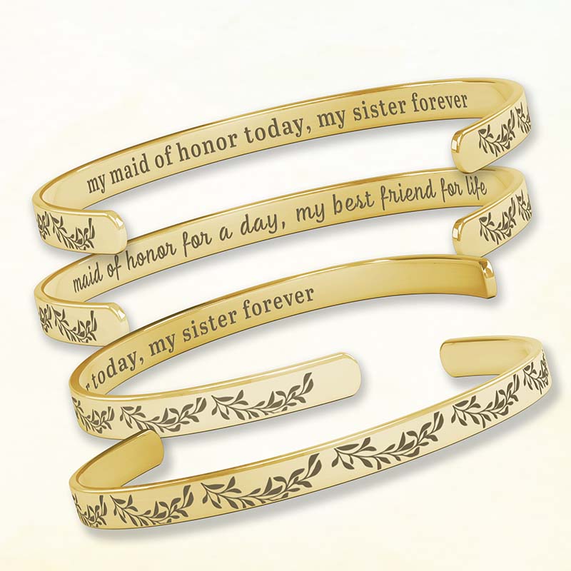 gifts for bridesmaids - gold bracelet with engraved text on a white background