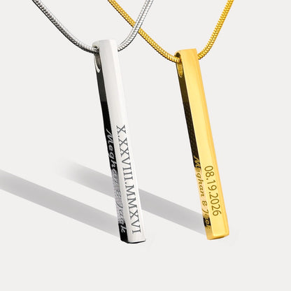 custom bar necklace: two personalized bar pendant necklaces on chains, one silver-toned and one gold-toned, with engraved text and Roman numerals, shown on a light gray background.