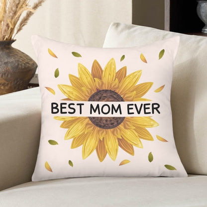 Off-white square decorative pillow cover featuring a bright sunflower design with floating leaves and "BEST MOM EVER" printed across a white banner overlay.   