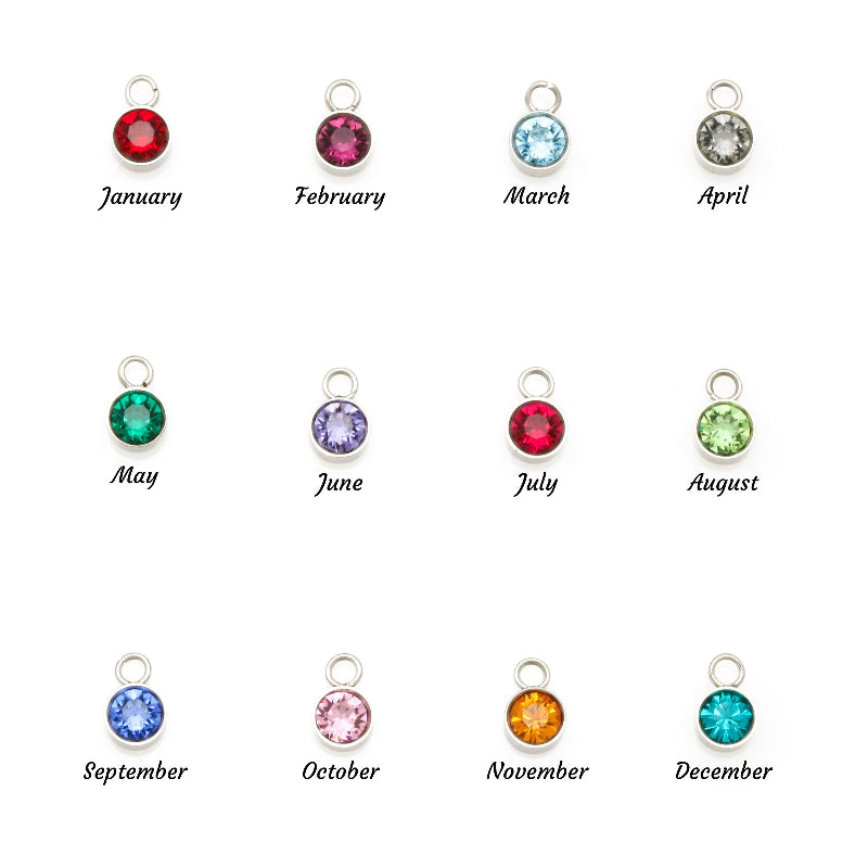 Pendants with gemstones for each month of the year on a white background