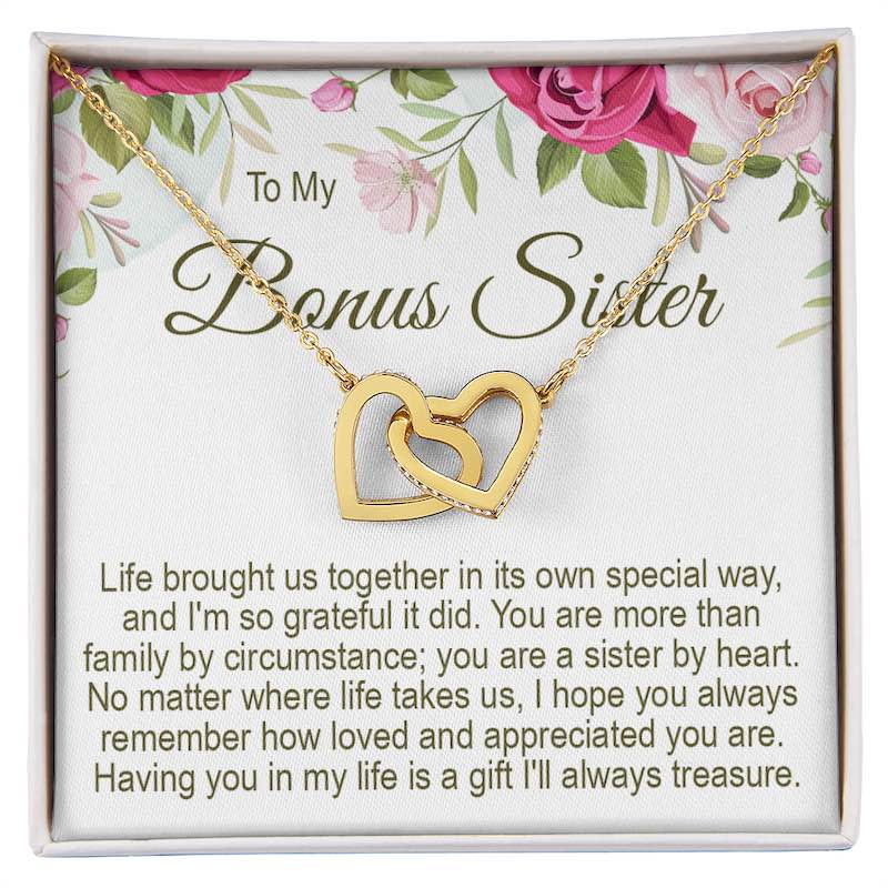 Personalised sister gift necklace: To My Bonus Sister gold interlocking heart necklace in a gift box with a floral message card.   
