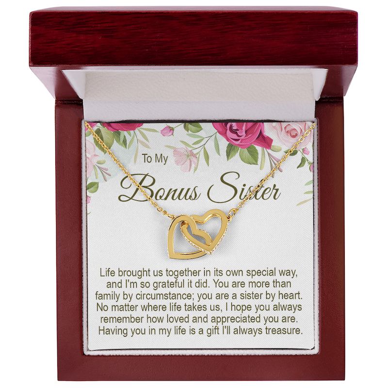 To My Bonus Sister gold interlocking heart necklace in a mahogany-style wooden gift box with a floral message card.   