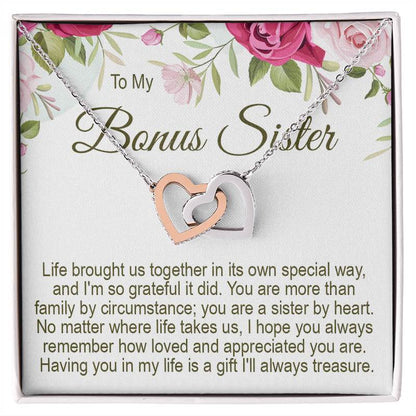 Bonus sister gifts: Interlocking rose gold and silver heart necklace presented in a gift box with a floral message card titled "To My Bonus Sister."