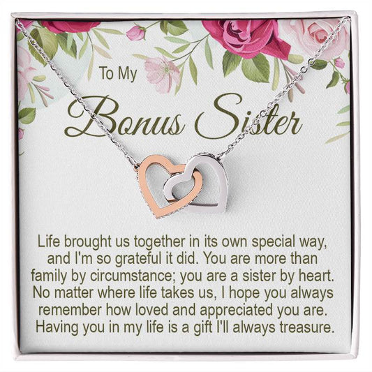 Bonus sister gifts: Interlocking rose gold and silver heart necklace presented in a gift box with a floral message card titled "To My Bonus Sister."