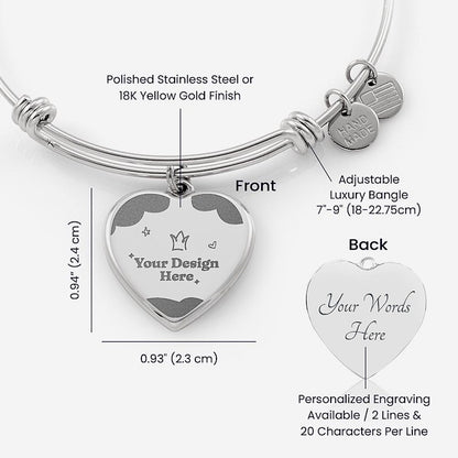 Silver adjustable bangle with heart-shaped engraving plate on a white background