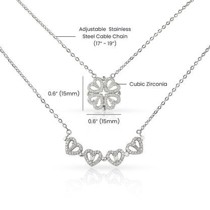 Silver necklace with heart designs and cubic zirconia stones on a white background