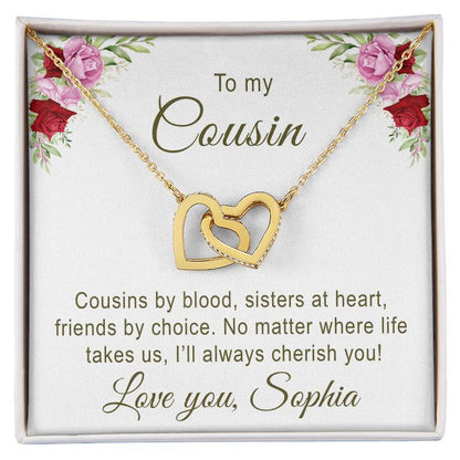 Gold necklace with interlocking hearts on a card with floral design and personalized message for cousin.