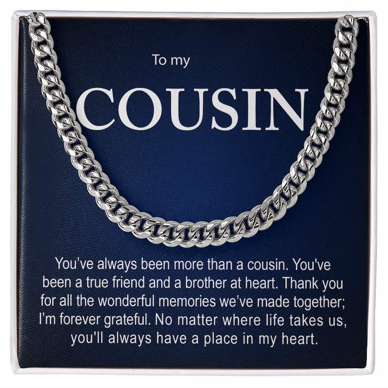 Silver Cuban link chain necklace displayed inside a white gift box against a dark blue card with a sentimental message titled "To my COUSIN".