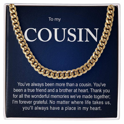 Men's gold Cuban link chain necklace presented inside a white gift box over a dark blue personalized card reading "To my COUSIN" with a heartfelt message