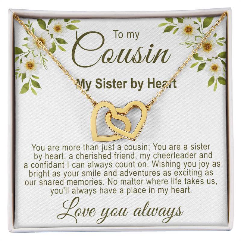 Unique gifts for cousins: Interlocking gold hearts necklace in a white gift box with a white floral cousin message card.