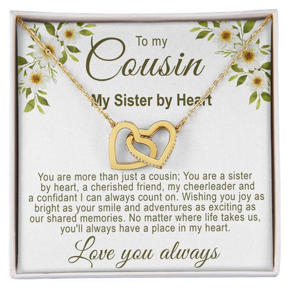 Unique gifts for cousins: Interlocking gold hearts necklace in a white gift box with a white floral cousin message card.