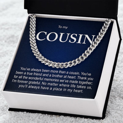 Silver Cuban link chain necklace displayed inside an open black gift box against a dark blue card reading "To my COUSIN" with a sentimental message.   