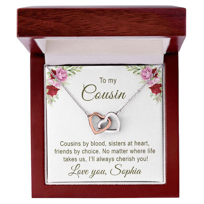 Necklace with interlocking hearts in a wooden box with a personalized message card for cousin.