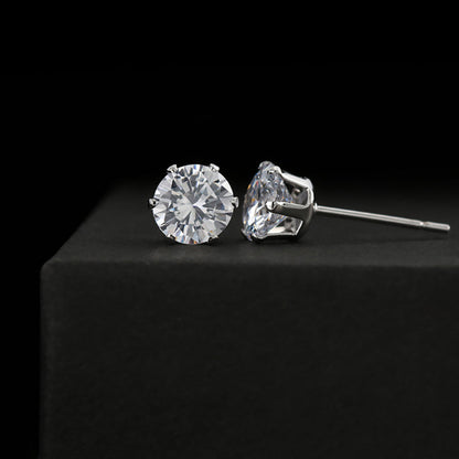 Cubic zirconia stud earrings on a black background