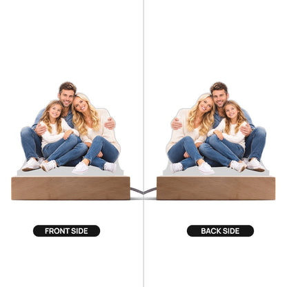 Front and back view of a custom double-sided acrylic family photo cutout plaque on a wooden LED base against a white background.