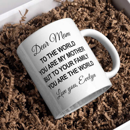 White mug with a message on a bed of brown crinkle paper