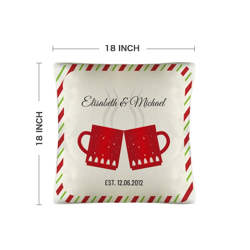 Decorative pillow with red christmas mugs personalized names and date, shown with pillow dimensions on a white background.