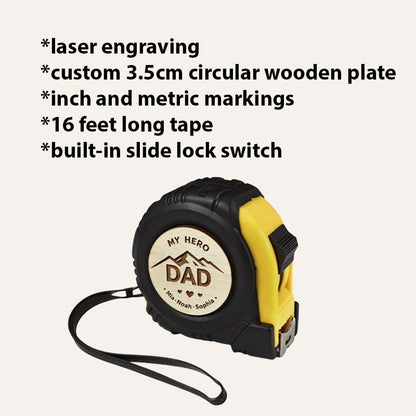 Personalized measuring tape with engraved wooden "My Hero Dad" insert and feature list highlighting laser engraving, 3.5 cm wooden plate, inch and metric markings, 16 ft tape, and slide lock.