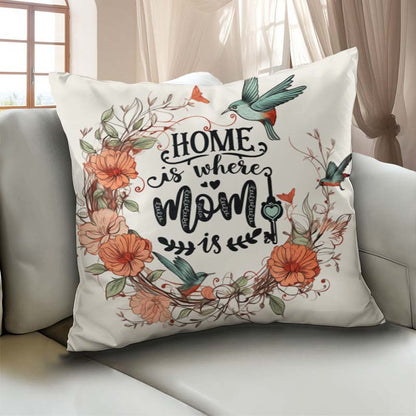 Decorative pillow with floral design and text on a couch