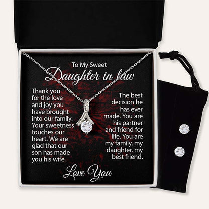 Silver ribbon pendant necklace displayed in a gift box with a heartfelt daughter-in-law message card and matching cubic zirconia stud earrings in a black velvet pouch.