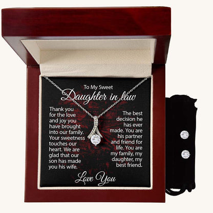 Silver ribbon pendant necklace displayed in a luxury mahogany gift box with a heartfelt daughter-in-law message card and matching cubic zirconia stud earrings in a black velvet pouch.