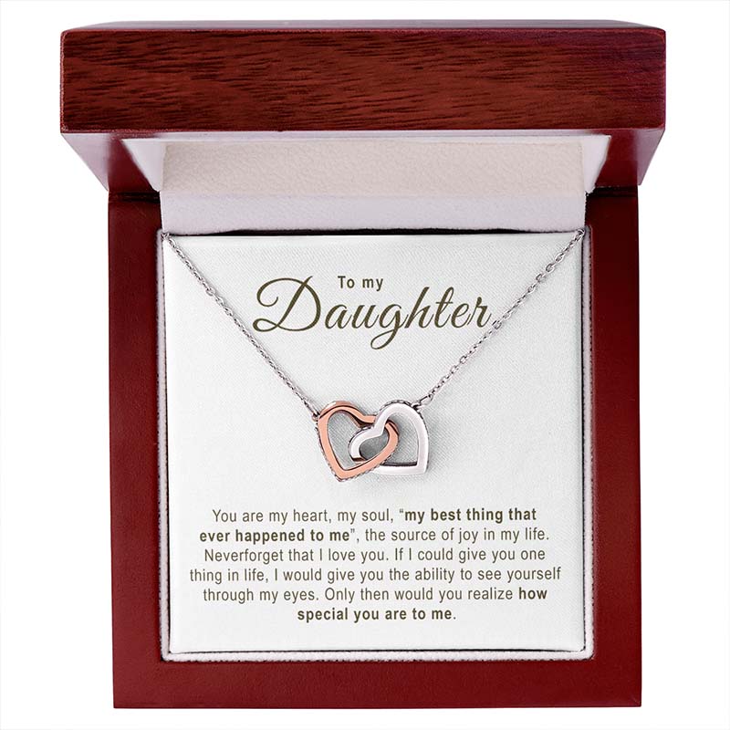 Necklace with interlocking hearts in a wooden box with a message for a daughter.