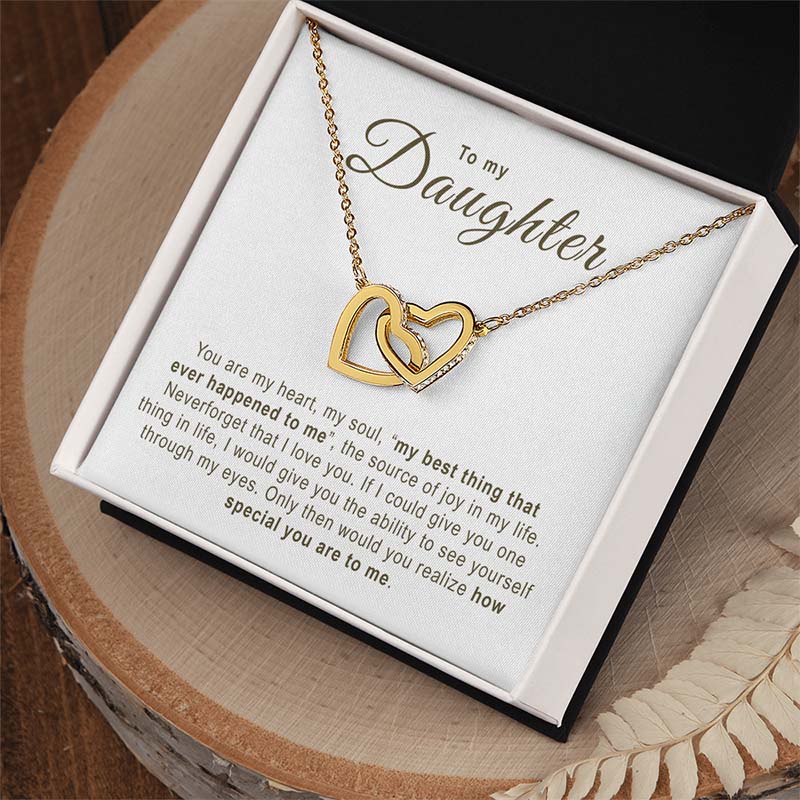 Gold necklace with interlocking hearts in a gift box with a sentimental message.