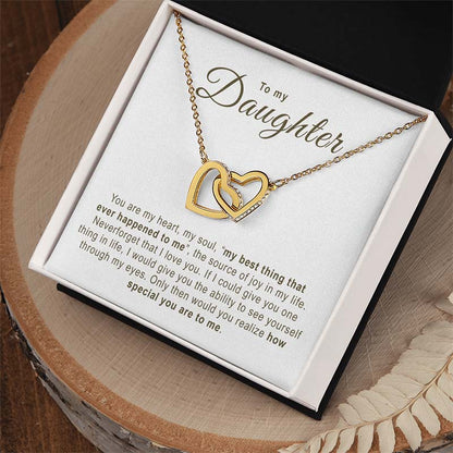 Gold necklace with interlocking hearts in a gift box with a sentimental message.