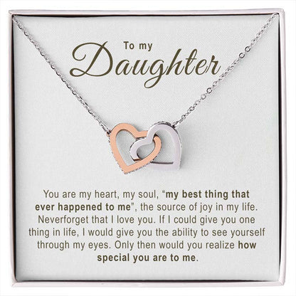 Necklace with interlocking heart pendants on a card addressed to a daughter, with sentimental text.