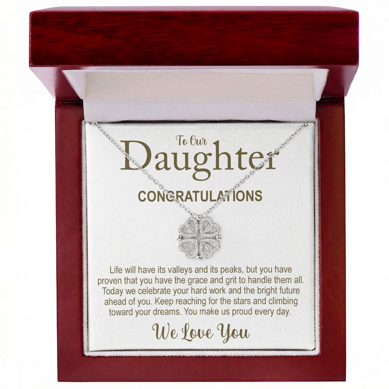 Necklace with a message card for 'To Our Daughter' in a wooden box