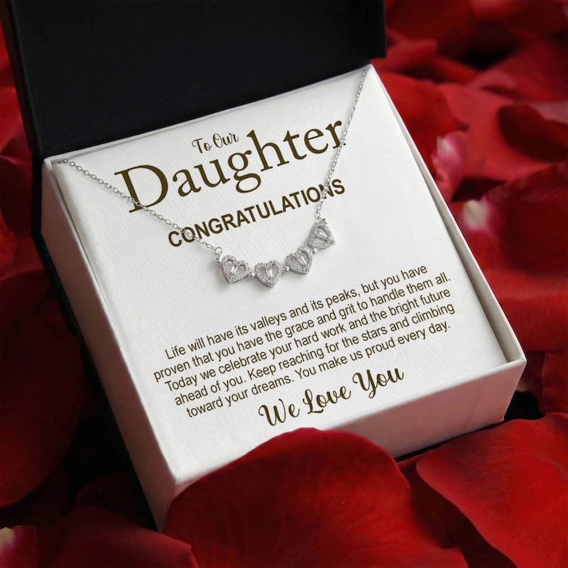 Necklace in a box with a message for graduation to 'Daughter' on red rose petals