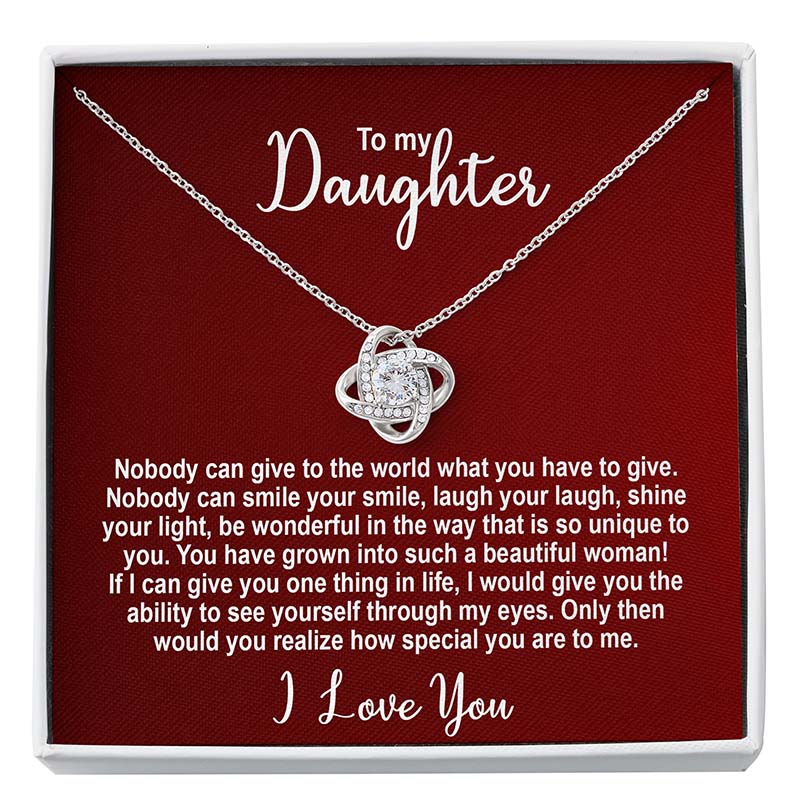 Silver knot necklace in a box with personalized message for a daughter on a red card.