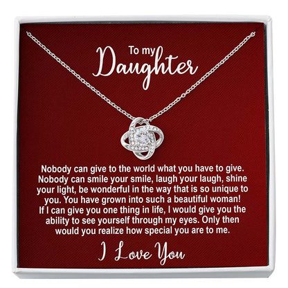 Silver knot necklace in a box with personalized message for a daughter on a red card.