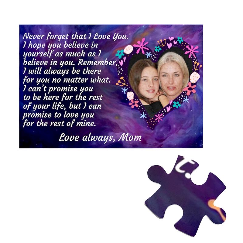 Custom rectangular jigsaw puzzle featuring a purple galaxy background, a photo of a mother and daughter framed inside a floral heart, a heartfelt message from Mom on the left, and a single loose puzzle piece below.