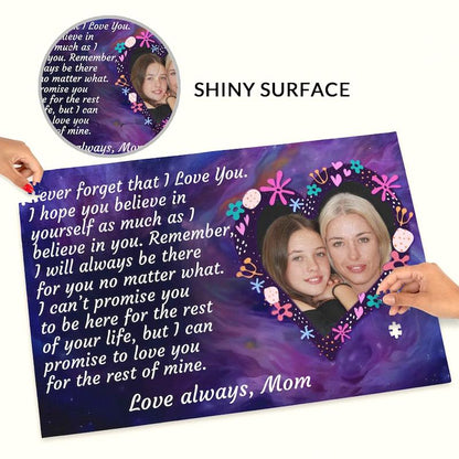 Hands placing a piece onto a custom mother-daughter photo puzzle, with a top inset labeled "SHINY SURFACE" highlighting the glossy finish of the printed design.   
