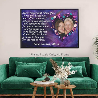Completed custom mother-to-daughter photo jigsaw puzzle framed and displayed on a wall above a green velvet sofa, labeled "*Jigsaw Puzzle Only, No Frame".   