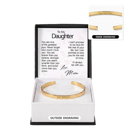 Gold engraved cuff bracelet in an open gift box with a "To My Daughter" message card from Mom, showing outer engraving on the main bracelet and an inset graphic labeled "Inside Engraving."