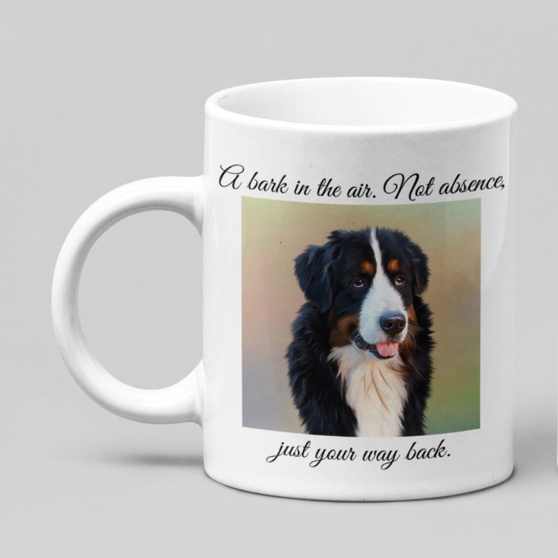 White mug with a Bernese Mountain dog picture and text on a gray background