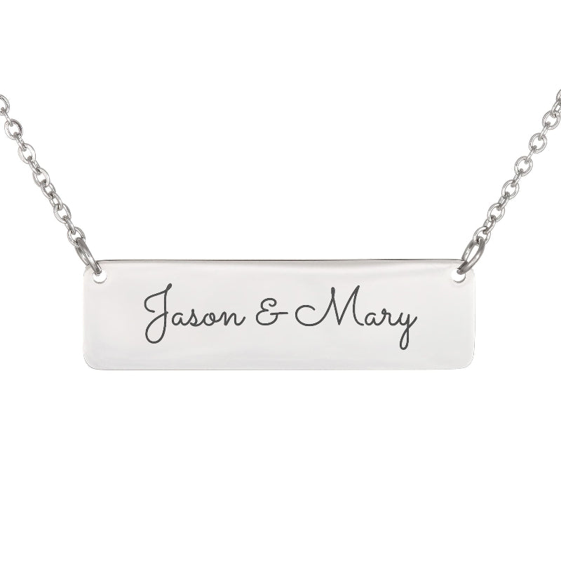 A silver rectangular bar necklace with the names 'Jason & Mary' engraved in black cursive script, shown against a plain white background.