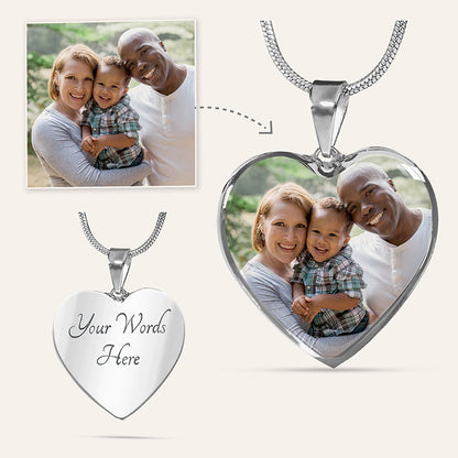 Heart-shaped photo necklace with a family photo and customizable text on a white background.