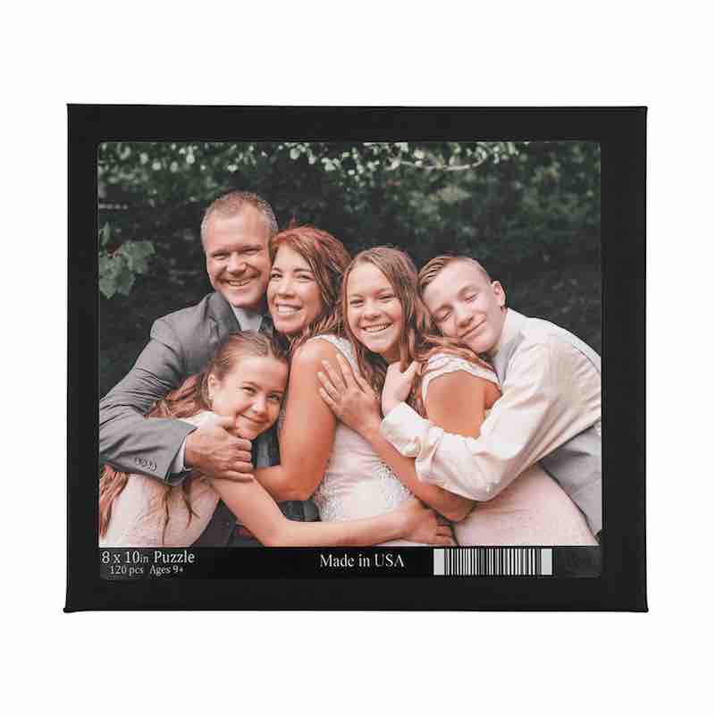 Black box for an 8x10 custom photo puzzle featuring a smiling family of five hugging outdoors.