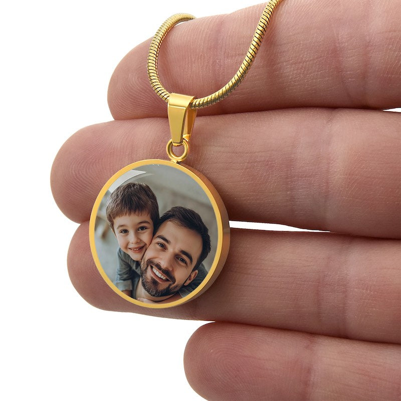 Gold personalized circle photo pendant necklace with father and son image held in hand